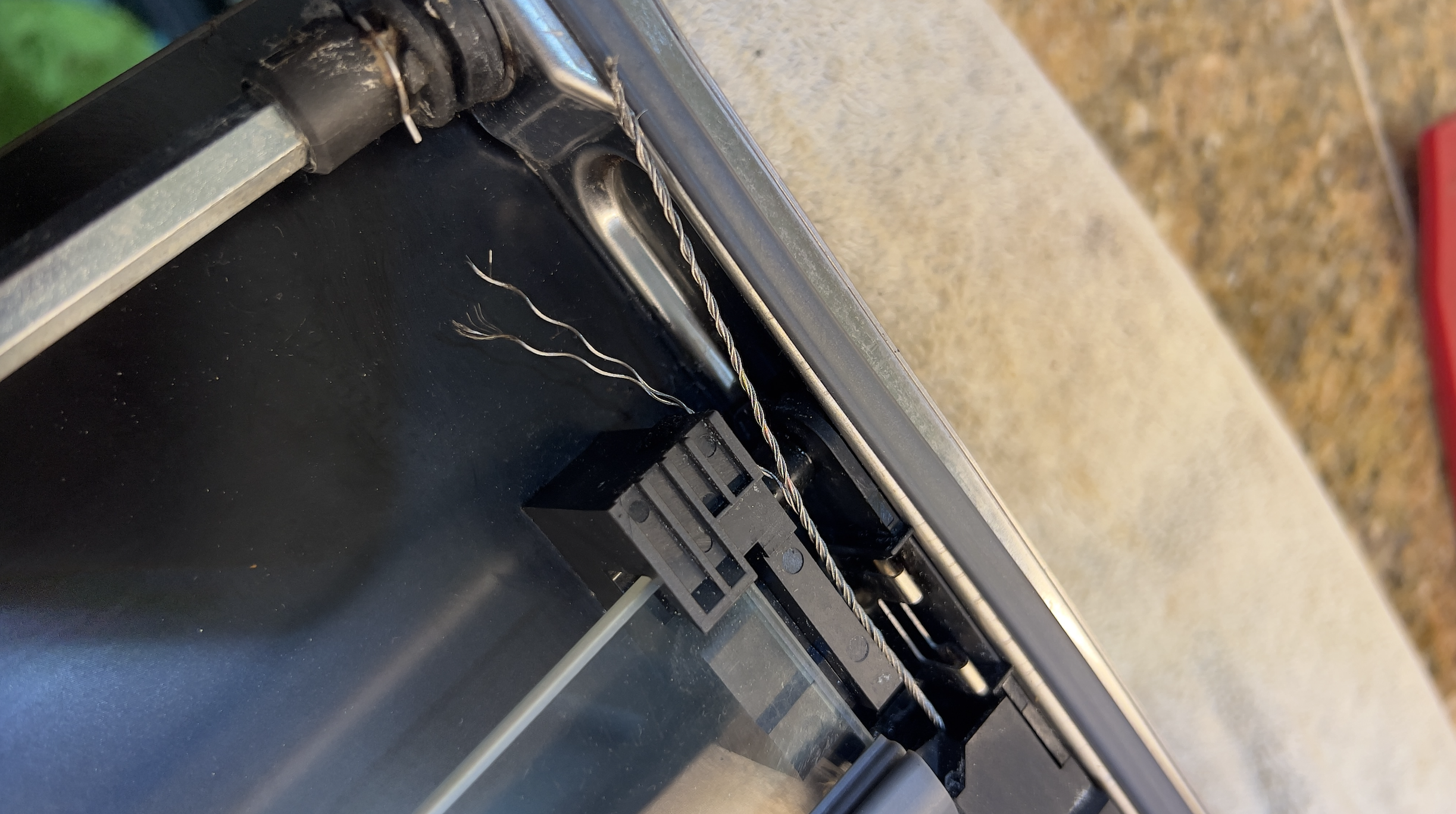 frayed steel cable neff-slide-n-hide door